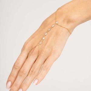 Gold‑plated sterling silver Shahmeran bracelet featuring intricate filigree and sparkling cubic zirconia stones.