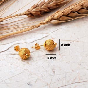 Handcrafted Kazaziye earrings made of 1000k sterling silver with a gold‑plated finish, featuring intricate woven wire knots and a small 8 mm diameter design.