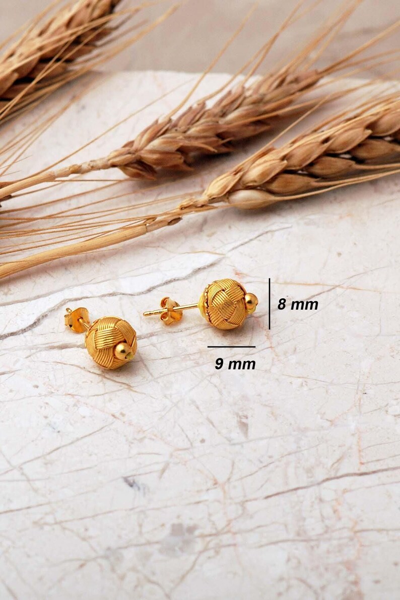 Handcrafted Kazaziye earrings made of 1000k sterling silver with a gold‑plated finish, featuring intricate woven wire knots and a small 8 mm diameter design.