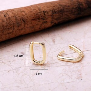 Handcrafted gold-plated 925 sterling silver oval hoop earrings with a smooth, polished finish and seamless closure.