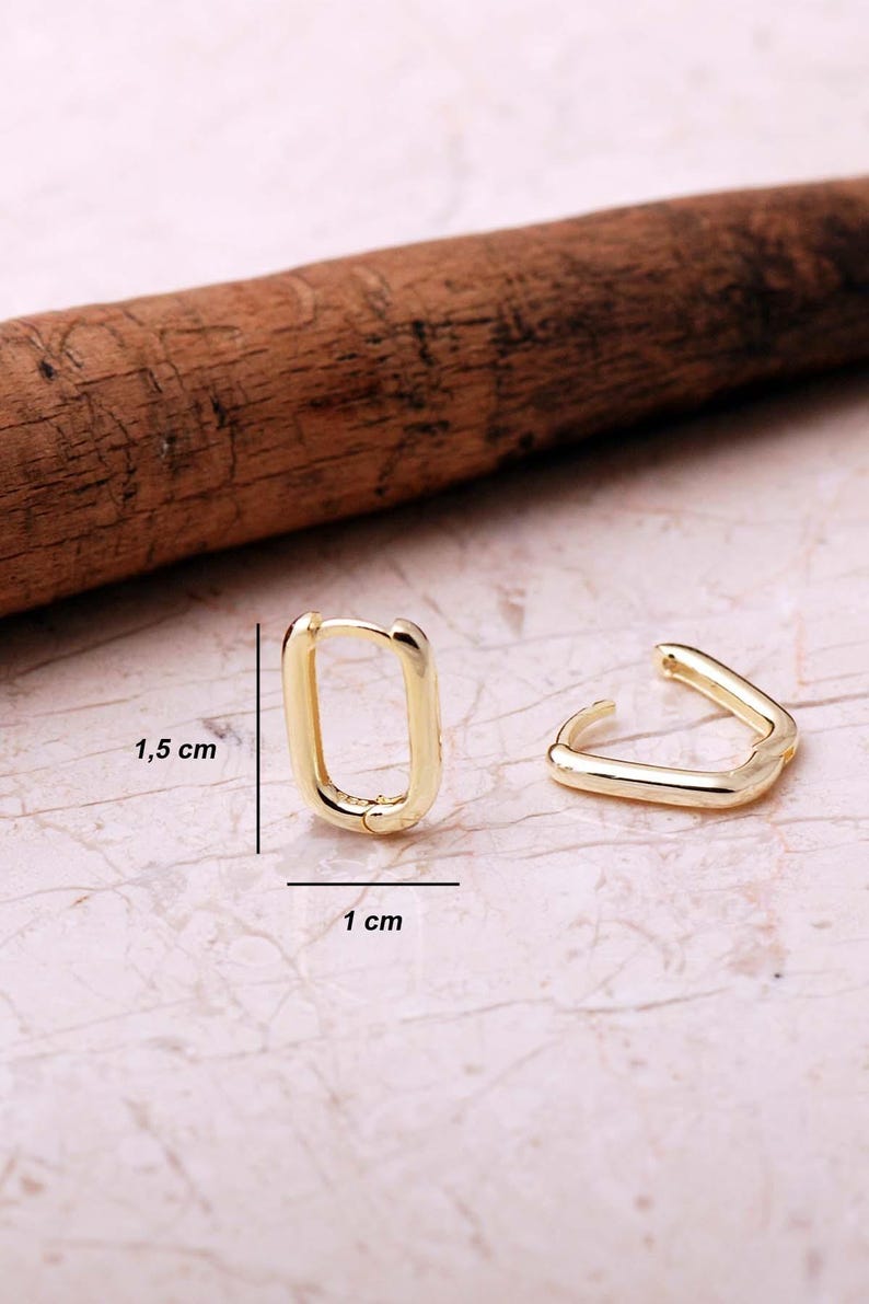 Handcrafted gold-plated 925 sterling silver oval hoop earrings with a smooth, polished finish and seamless closure.