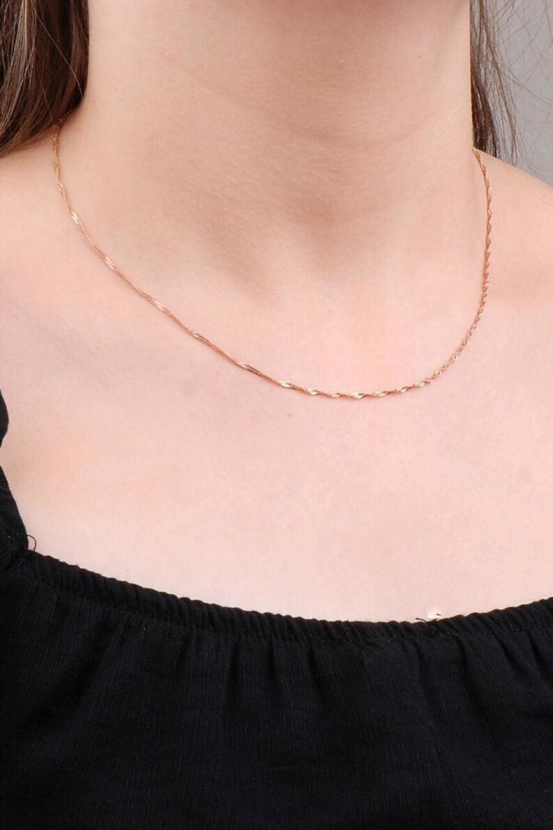 A 45 cm long rose gold finish chain made of 925 sterling silver, displayed flat with smooth cable links.