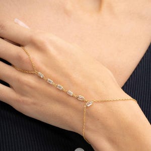 Gold‑plated sterling silver Shahmeran bracelet featuring intricate filigree and sparkling cubic zirconia stones.
