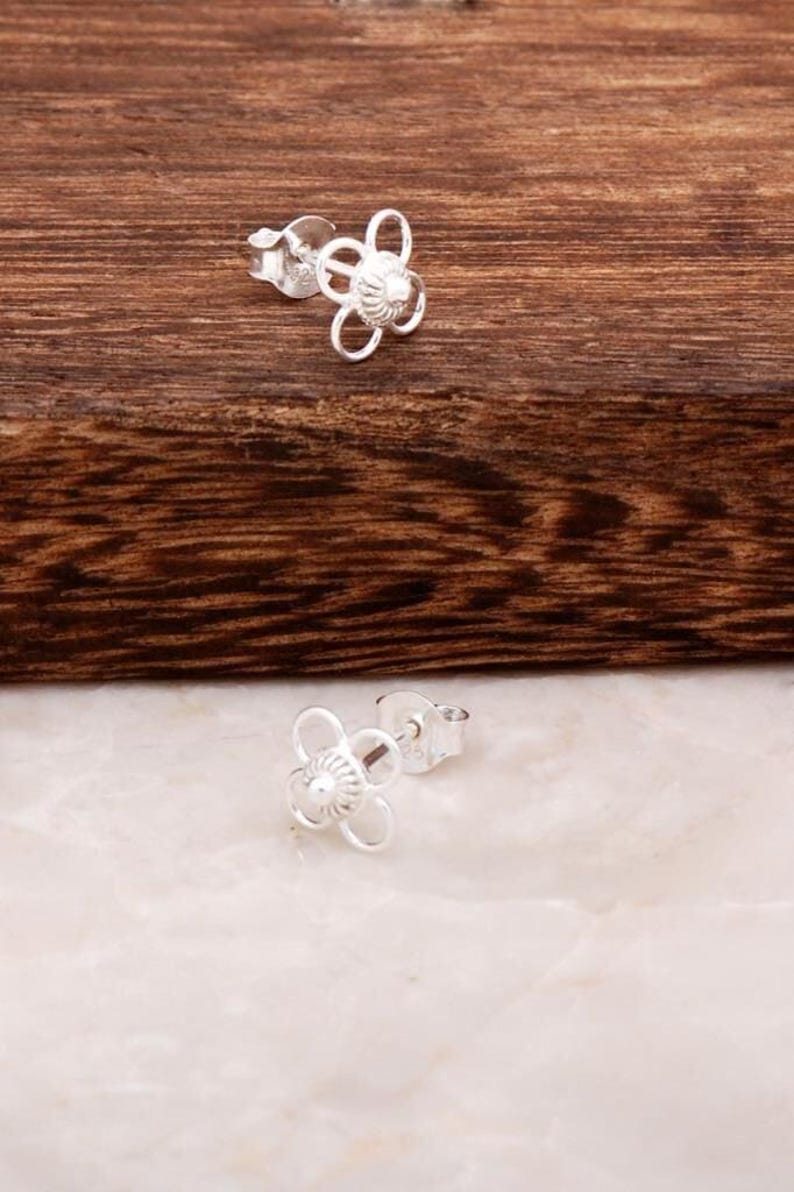 Handmade 925 sterling silver stud earrings featuring delicate filigree wirework in a small circular dot shape.