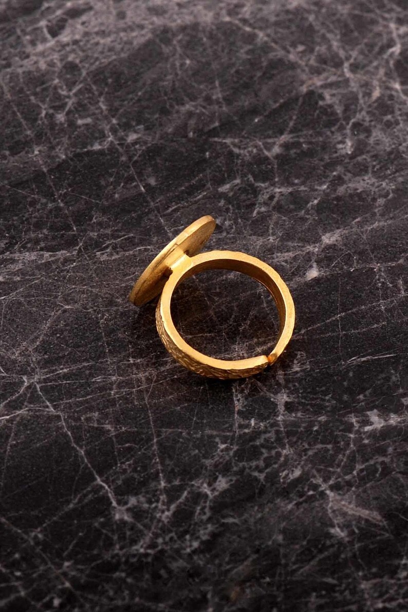 Handmade adjustable ring in 925 sterling silver with a green gold plated finish, featuring a detailed life flower motif on the band.
