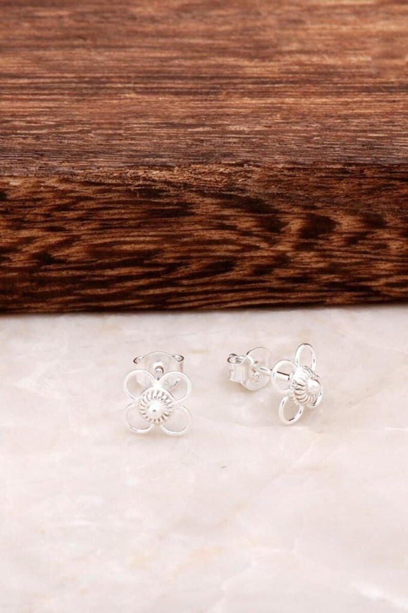 Handmade 925 sterling silver stud earrings featuring delicate filigree wirework in a small circular dot shape.