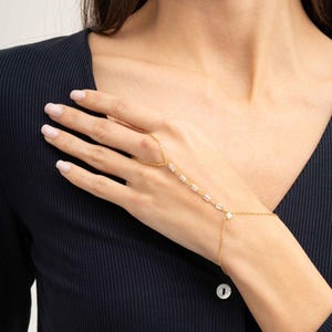 Gold‑plated sterling silver Shahmeran bracelet featuring intricate filigree and sparkling cubic zirconia stones.