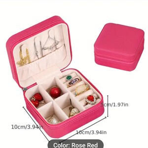 May include: Rose red jewellery box, open to display rings, necklaces, and earrings. The box is 10cm wide and 5cm tall. A closed box is also shown. The text "Color: Rose Red" is at the bottom.