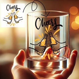 May include: A clear glass tumbler with a "Cheers" graphic. The design features two hands toasting beer bottles with yellow accents. The glass is held in a person's hand, with a blurred background.