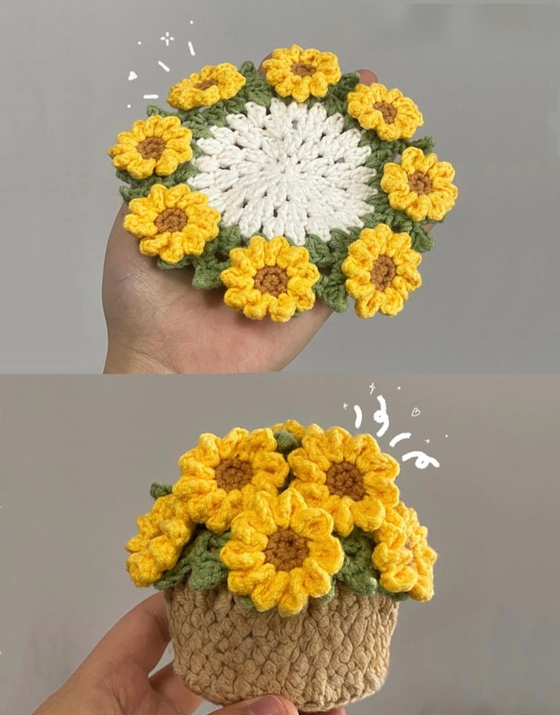 May include: A round, white crocheted coaster with a border of yellow sunflowers and green leaves, and a small, tan crocheted basket filled with yellow sunflowers and green leaves, both featuring small white decorative sparkles.