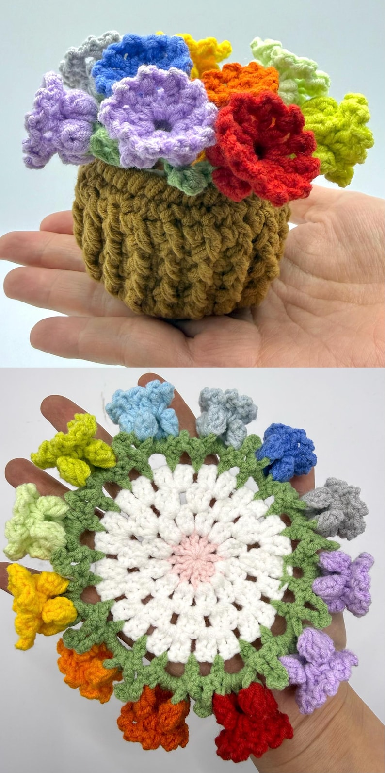 May include: A small, brown, crocheted pot filled with multi-colored yarn flowers in shades of red, orange, yellow, green, blue, and purple. Below, a circular, white, crocheted doily features a pink center and a green border with small flowers.