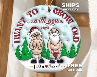 May include: A round Christmas ornament featuring a cartoon couple dressed as Santa and Mrs. Claus. The ornament has the text "I WANT TO GROW OLD with you 2025" and the names "julia ❤️ Jacob". The ornament is white with a gold string.