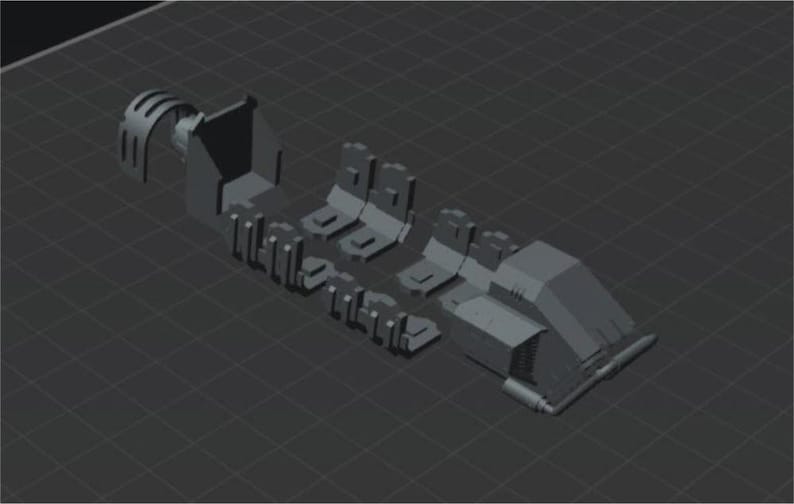 May include: A gray 3D-rendered model of a mechanical device, possibly a robotic arm or similar component. The model is composed of several distinct parts, including a claw-like structure, multiple rectangular sections, and a larger, angled body.