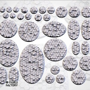 May include: A set of 18 round and oval-shaped miniature bases for tabletop gaming. The bases are made of a textured, gray material and feature a hexagonal pattern. The bases are designed to represent a futuristic or sci-fi environment.