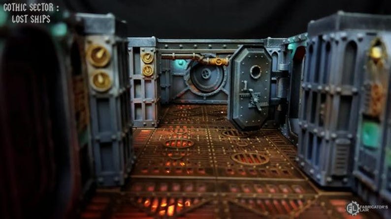 May include: A detailed model of a futuristic, industrial-style corridor with metal walls and a grated floor. The walls are painted in shades of gray and blue, with accents of gold and green. The floor is a dark brown with a grid pattern. The corridor is lit by a soft, warm light. The text "Gothic Sector: Lost Ships" is visible at the top of the image.