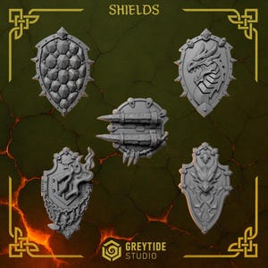 May include: An assortment of gray fantasy shields with various designs, including a dragon, spikes, and flames. The word "SHIELDS" is at the top. The GreyTide Studio logo is at the bottom.