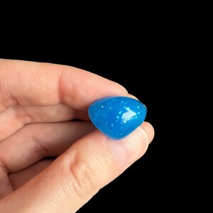 May include: A small, blue, speckled, heart-shaped, silicone mold.