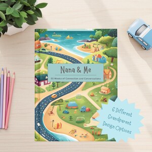 May include: A colorful illustrated book titled "Nana & Me" with the text "52 Weeks of Connection and Conversations." The cover features a scenic illustration of a road, beach, and camping area. A blue toy car and colored pencils are also present.