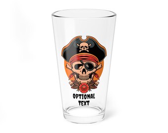 May include: A clear glass pint glass with a printed design of a skull wearing a pirate hat and an eye patch. The skull is surrounded by a red flower and leaves. The text "OPTIONAL TEXT" is printed below the skull.