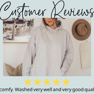 May include: A grey hooded sweatshirt with a five-star rating and the text "So comfy. Washed very well and very good quality!"