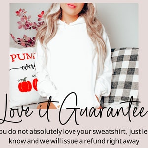 May include: A white hooded sweatshirt with the text "Love it Guarantee" and the message "If you do not absolutely love your sweatshirt, just let us know and we will issue a refund right away".
