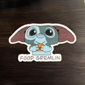 Adorable Food Gremlin Sticker with Cheeseburger - Cute Vinyl Decal