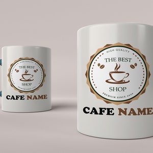 May include: Two white ceramic coffee mugs with blue handles. Both mugs feature a brown logo with the text "The Best Shop" and a coffee cup graphic. The text "Cafe Name" is printed below the logo on both mugs.