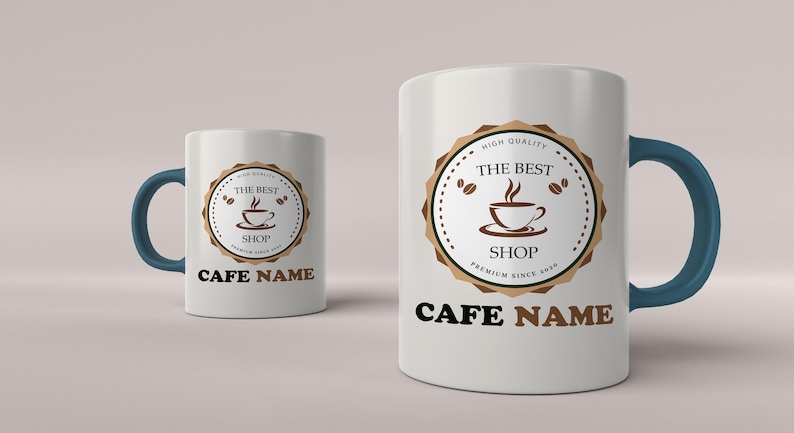 May include: Two white ceramic coffee mugs with blue handles. Both mugs feature a brown logo with the text "The Best Shop" and a coffee cup graphic. The text "Cafe Name" is printed below the logo on both mugs.