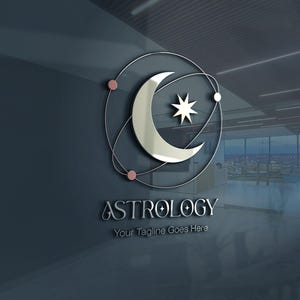 May include: A silver logo for "Astrology" featuring a crescent moon, a star, and orbiting lines with pink dots. The text "Astrology" and "Your Tagline Goes Here" are below the logo, all set against a dark blue background.