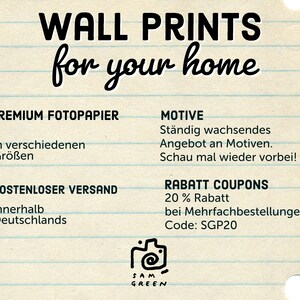 May include: An image with the text "WALL PRINTS for your home." Additional text includes "PREMIUM FOTOPAPIER," "MOTIVE," and "RABATT COUPONS." The image has a notebook paper background with a camera logo and the name "SAM GREEN."
