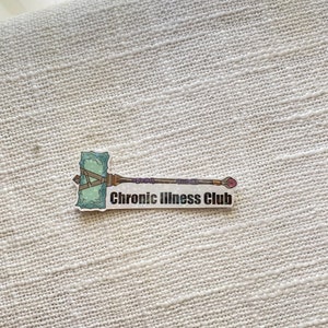 May include: A sticker with a cartoon illustration of a green and purple hammer with the text "Chronic Illness Club".