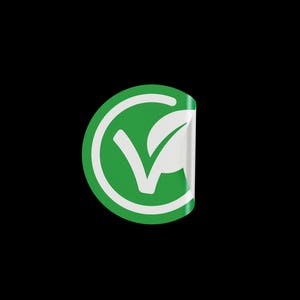 May include: A green circle sticker with a white checkmark and a leaf inside. The sticker has a white border and is peeling off at the top.