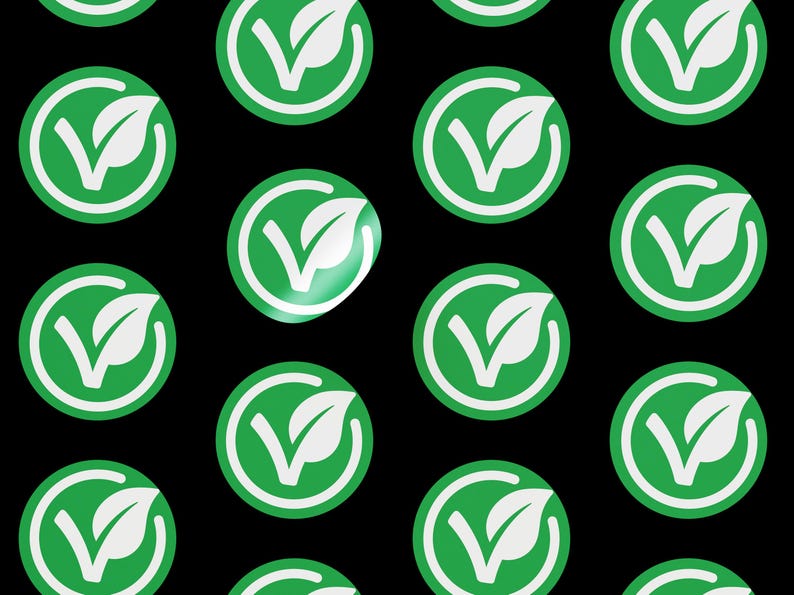 May include: A repeating pattern of green circles with a white checkmark and leaf design on a black background.