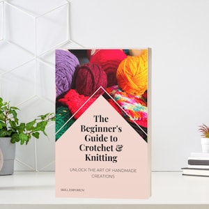 May include: A book cover with the title "The Beginner's Guide to Crochet & Knitting" and the subtitle "Unlock the Art of Handmade Creations". The cover features a colorful pile of yarn in shades of purple, red, yellow, and green.