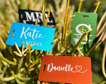Customized Luggage Tag for Suitcase Metal baggage tag with laser engraving secured with a stainless steel loop.
