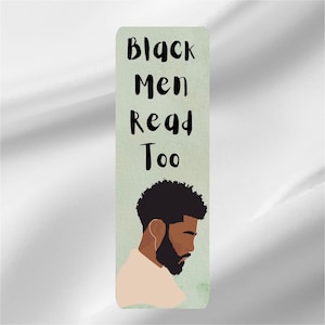 May include: A rectangular bookmark with the text "Black Men Read Too" in black script. The bookmark features an illustration of a Black man with a beard and afro. The background is a light green color.