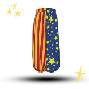 May include: Colorful, patterned pants with a unique design. One leg features vertical red and yellow stripes, while the other is blue with yellow stars. The pants have a drawstring waistband and a relaxed fit.