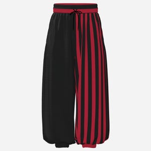 May include: Loose-fitting pants featuring a split design with a solid black left leg and a vertical red and black striped right leg. The waistband is red and black with a black drawstring, and the cuffs are gathered at the ankles.