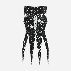 May include: A sleeveless black top featuring a white star pattern throughout. The garment has a square neckline with a central white lace-up closure and a hemline that is cut into four long, pointed panels that hang down from the waistline.