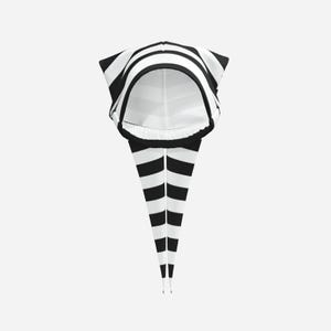 May include: A hood featuring a bold black and white horizontal striped pattern. The design includes a rounded head covering section with a wide opening and two long, pointed, tapering tails that extend downward, also decorated with stripes.