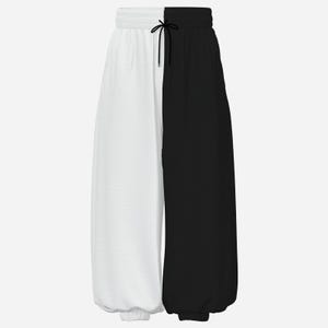 May include: These sweatpants feature a split-color design with a solid white left leg and a solid black right leg. The garment includes an elastic waistband with a black drawstring cord centered at the top, and elasticized cuffs at the ankles.
