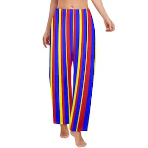 May include: Loose-fitting pajama pants with vertical stripes in blue, red, and yellow. The pants are made of a soft material and have a relaxed fit. The colorful design is eye-catching and suitable for lounging.
