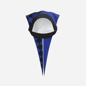 May include: A head covering featuring a blue and black checkered pattern on one side and solid blue on the other. The item has a wide black circular opening at the top, a black trim around the edge, and two long, pointed fabric tails extending downward.