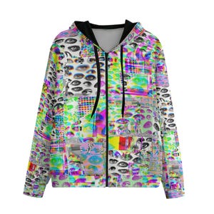 May include: A white zippered hoodie with a colorful, psychedelic print of eyes and geometric shapes. The print is a mix of bright colors, including pink, green, blue, and yellow.