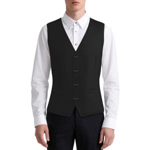 May include: A solid black waistcoat featuring a V-neckline and a four-button front fastening. The waistcoat is worn over a crisp white long-sleeved button-down shirt with a pointed collar and dark trousers, creating a formal and structured appearance.