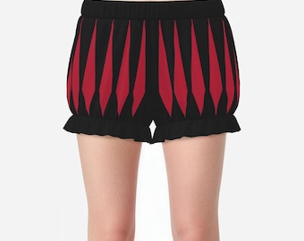 May include: Black and red shorts featuring a vertical diamond-shaped pattern. The garment has a high-waisted elastic waistband and a ruffled hemline at the bottom of each leg opening, creating a voluminous, puffy silhouette.