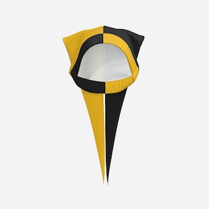 May include: A head covering featuring a split design with one side in solid black and the other in solid yellow. The item has a rounded opening for the face and two long, pointed fabric tails extending downwards from the base of the opening.