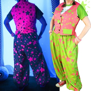 May include: A two-piece outfit consisting of a waistcoat and loose-fitting trousers. The left side shows a black waistcoat and trousers with pink stars. The right side shows a lime green waistcoat and trousers with pink stars, worn over a white t-shirt.