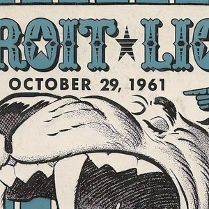 May include: Vintage Detroit Lions poster from October 29, 1961, featuring the team name in teal letters with star accents. A roaring lion graphic is below the text, with pointing hand illustrations on either side.