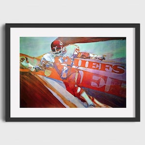 May include: A watercolor painting of a football player in a red and white uniform running with the ball. The player is wearing a helmet and is surrounded by a blur of colors. The words "Chiefs" and "34" are visible in the background.